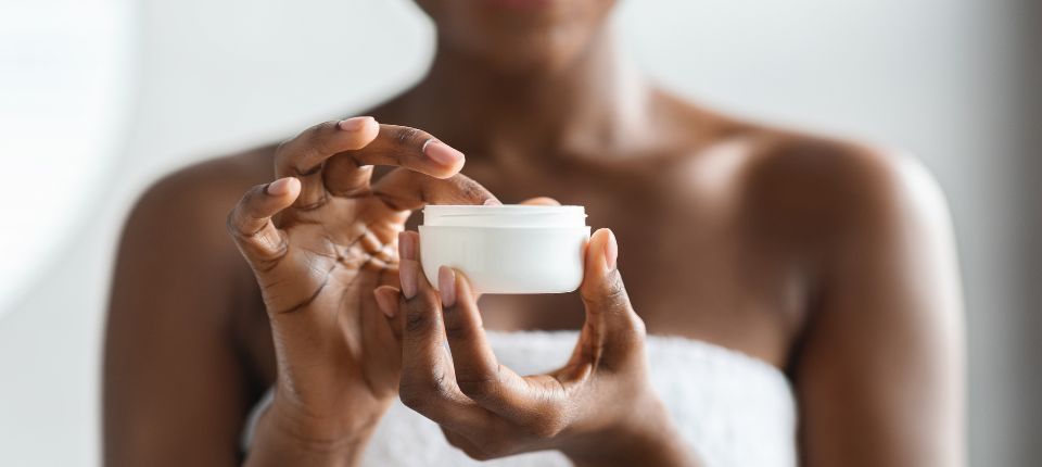 woman applying body butter