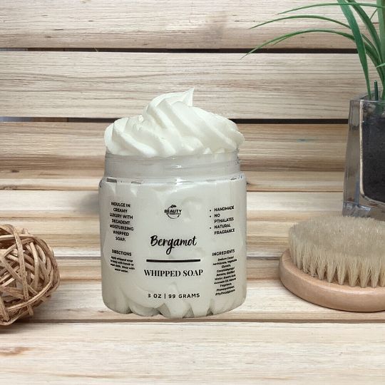 Bergamot Whipped Soap wood background next to brush