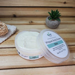 Bliss Whipped Body Butter Next to Plant