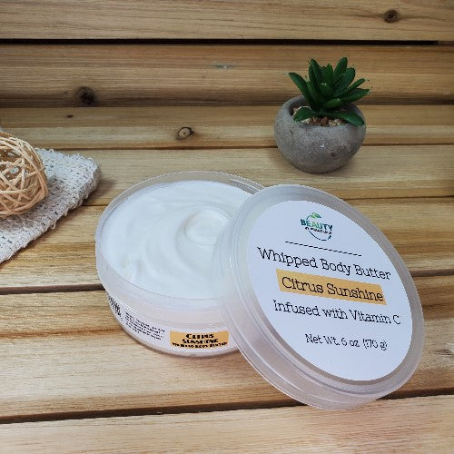 Citrus Sunshine Body Butter Next to Plant