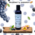 Blueberry Passion Body Wash on wood pedestal blueberry and passion fruit background