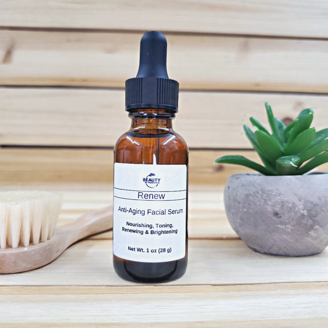 renew facial serum next to plant and facial brush